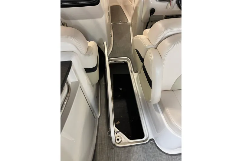 Slide: The Image of 2016 Chaparral 287 SSX interior with open floor storage compartment. - 9