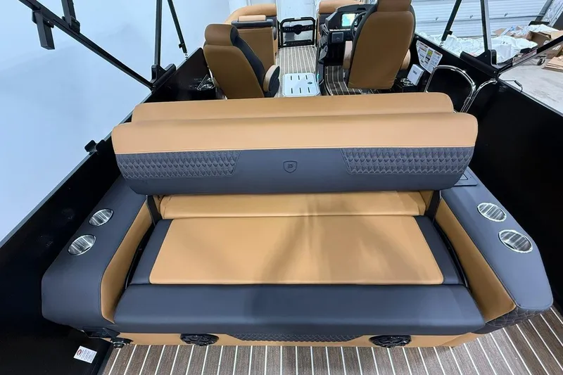 Slide: The Image of Luxury seating on 2026 Premier 230 SOLARIS RL-CL boat, featuring tan and gray upholstery. - 10
