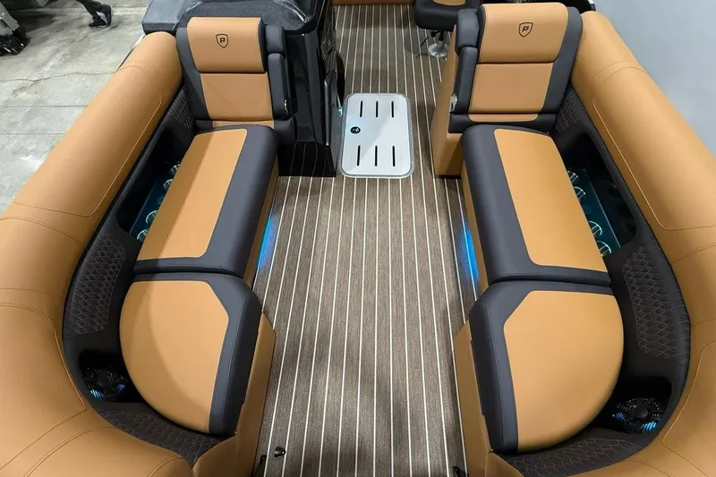 Slide: The Image of Luxurious interior of 2026 Premier 230 SOLARIS RL-CL boat with tan and black seating. - 7