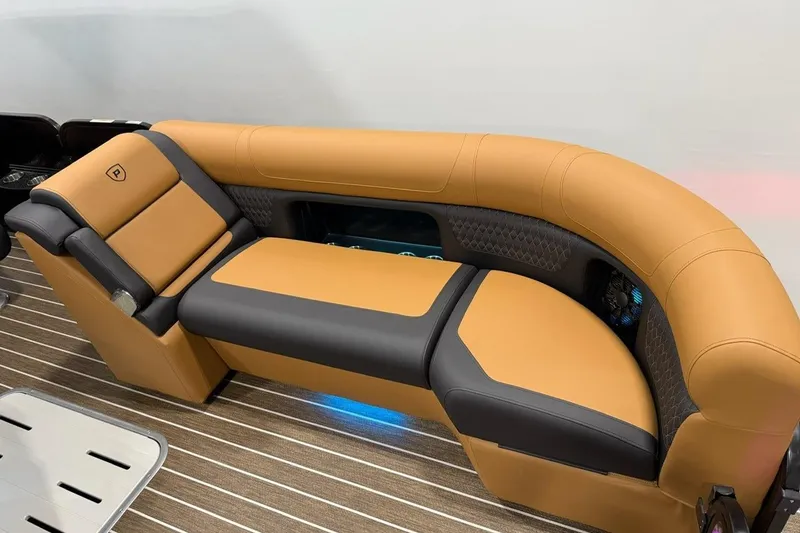 Slide: The Image of Luxurious seating on 2026 Premier 230 SOLARIS RL-CL boat, featuring tan and black upholstery. - 8