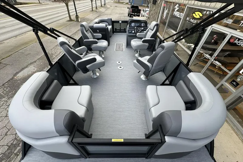 Slide: The Image of 2026 Godfrey Sweetwater 2286QS pontoon boat interior with plush seating and modern design. - 10