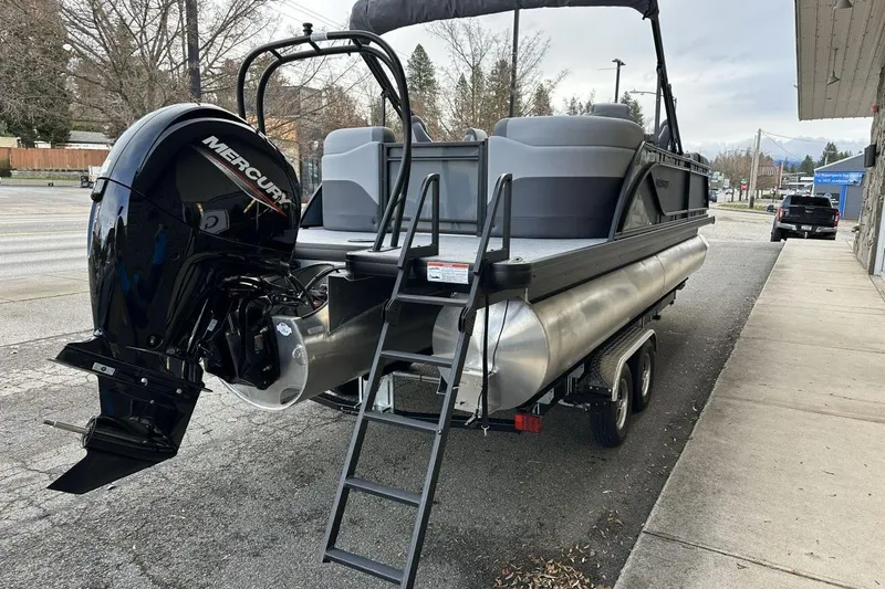 Slide: The Image of 2026 Godfrey Sweetwater 2286QS pontoon boat with Mercury outboard motor on trailer. - 11