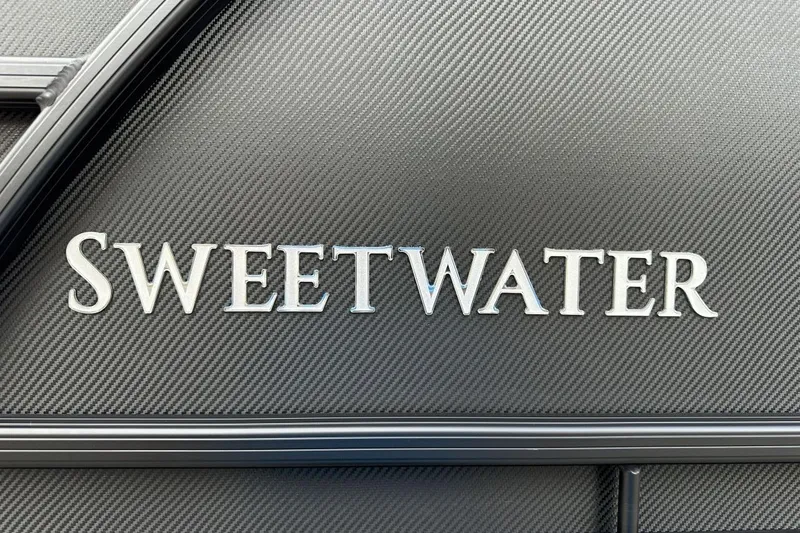 Slide: The Image of Sweetwater 2286QS logo on textured surface, Godfrey 2026 model. - 3