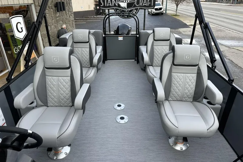 Slide: The Image of 2026 Godfrey Sweetwater 2286QS pontoon boat interior with luxurious gray seating. - 7