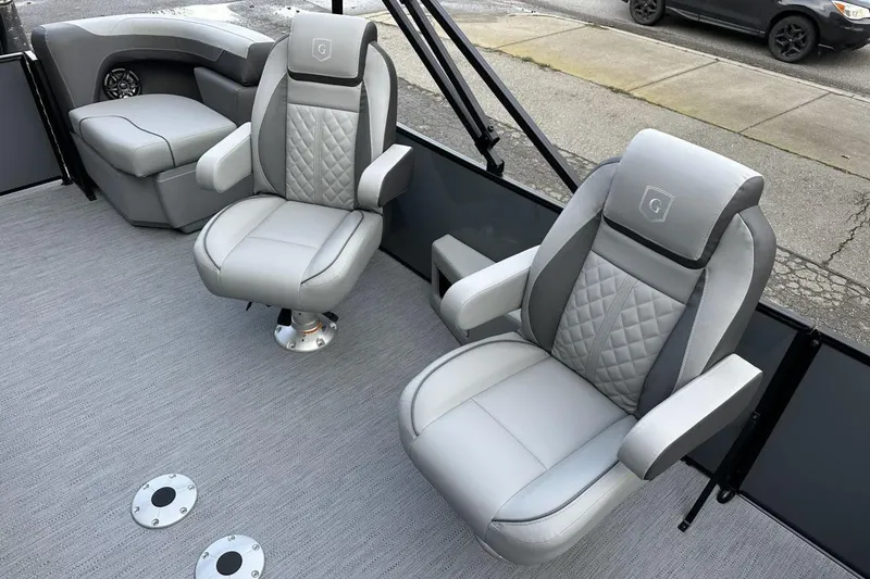 Slide: The Image of Luxurious seating on 2026 Godfrey Sweetwater 2286QS pontoon boat, featuring plush gray upholstery. - 8