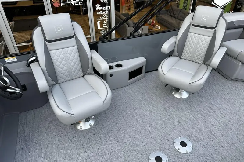 Slide: The Image of 2026 Godfrey Sweetwater 2286QS boat interior with luxurious gray seating and modern design. - 9
