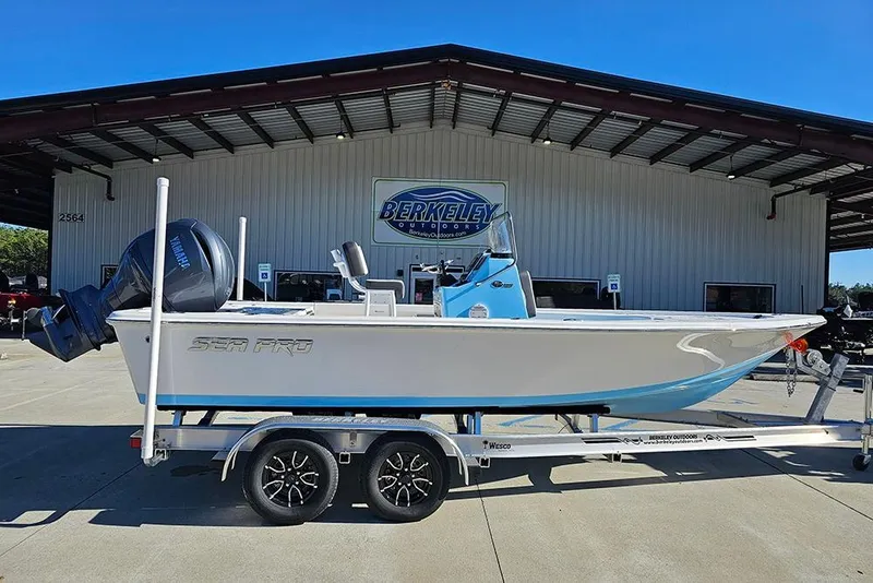 The Image of 2026 Sea Pro 210 Bay boat on trailer at Berkeley Outdoors dealership. - 1