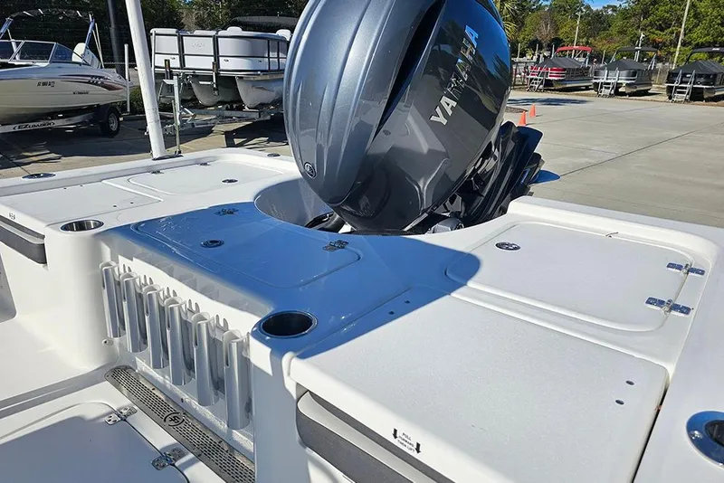 Slide: The Image of 2026 Sea Pro 210 Bay boat with Yamaha engine, docked with other boats. - 10