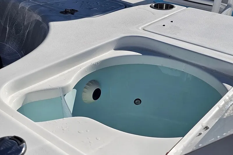 Slide: The Image of Livewell on 2026 Sea Pro 210 Bay boat, featuring a clean, white design. - 12