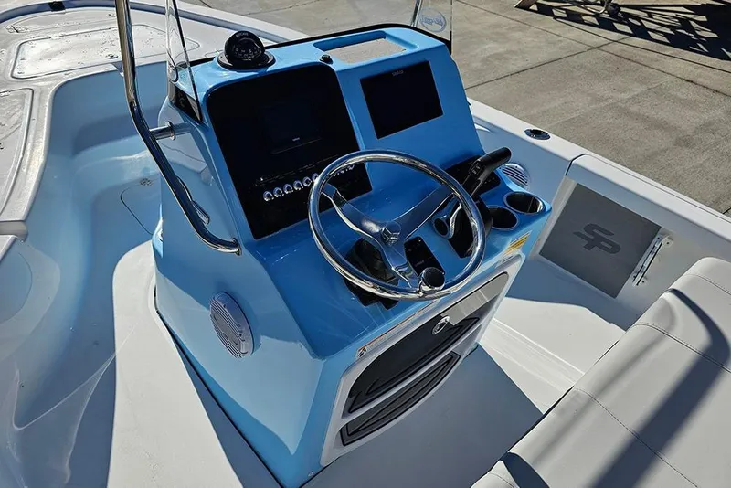 Slide: The Image of 2026 Sea Pro 210 Bay boat dashboard with steering wheel and controls. - 19