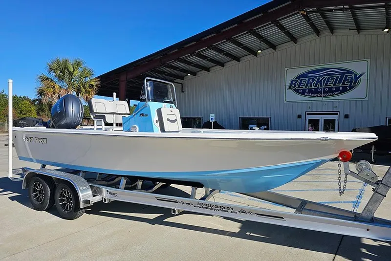 Slide: The Image of 2026 Sea Pro 210 Bay boat on trailer at Berkeley Outdoors dealership. - 2