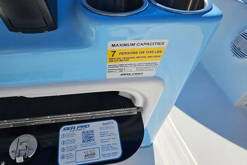 Slide: The Image of 2026 Sea Pro 210 Bay boat capacity label, showing maximum of 7 persons or 1155 lbs. - 21