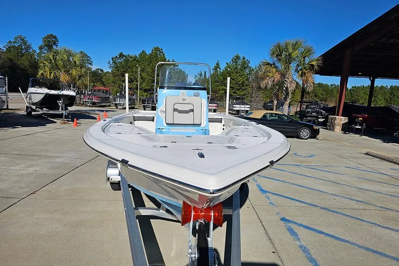 Slide: The Image of 2026 Sea Pro 210 Bay boat on trailer in sunny outdoor setting. - 4