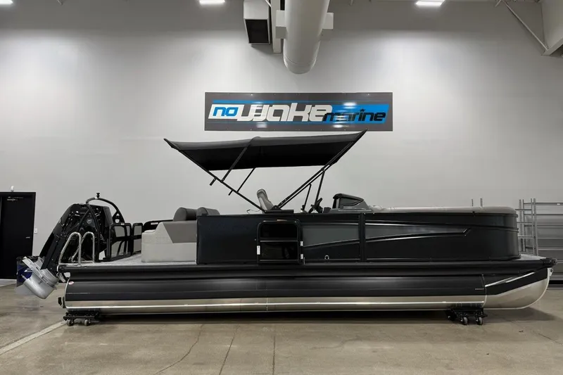 Slide: The Image of 2026 Premier 250 Intrigue RLO-CL pontoon boat displayed indoors at No Wake Marine. - 5