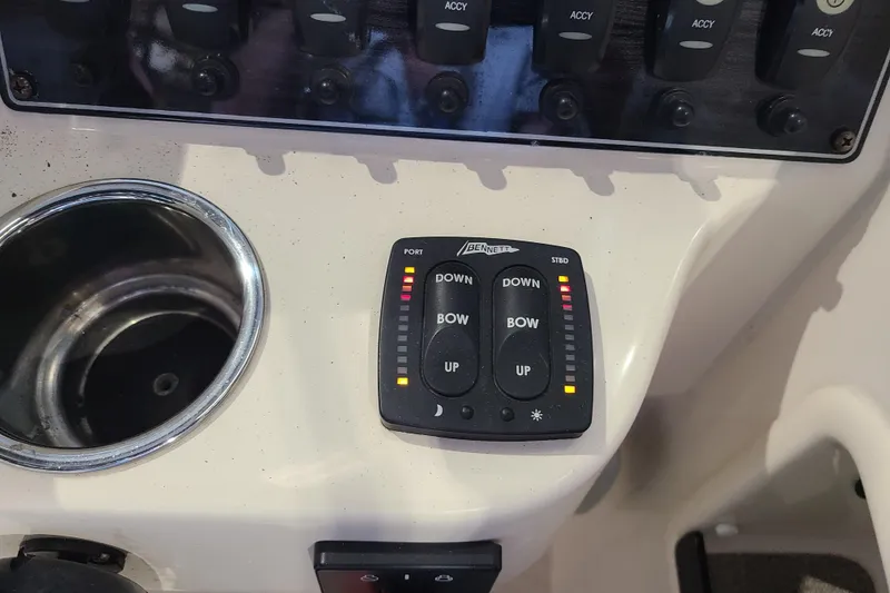 Slide: The Image of Control panel of a 2017 Grady-White Freedom 235 boat with cup holder. - 11