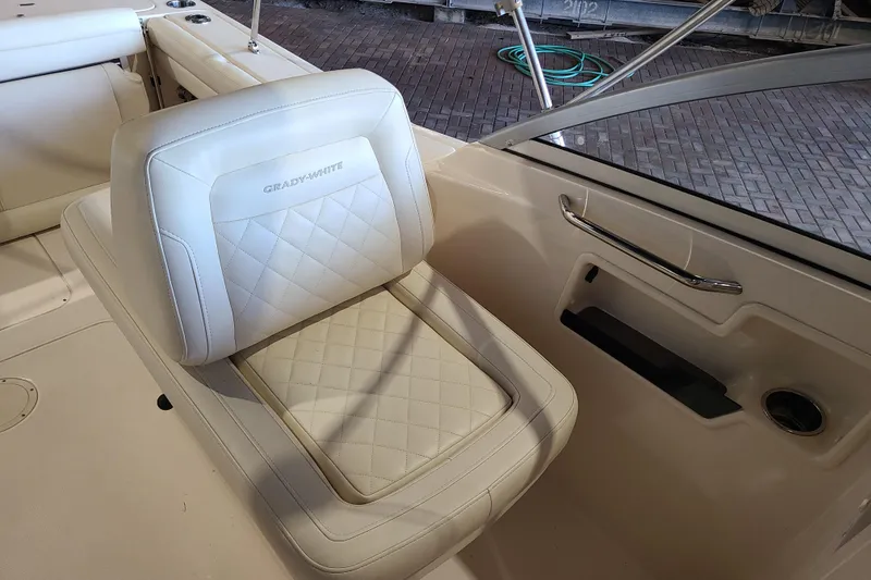 Slide: The Image of 2017 Grady-White Freedom 235 boat seat with quilted design and armrest. - 19
