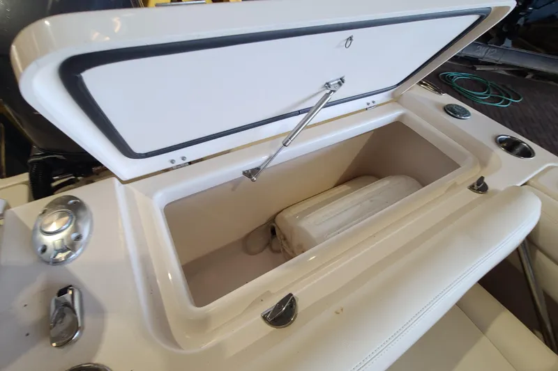 Slide: The Image of Open storage compartment on 2017 Grady-White Freedom 235 boat, showcasing interior space. - 24
