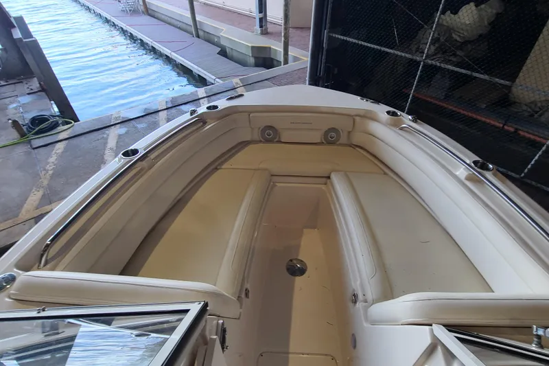 Slide: The Image of 2017 Grady-White Freedom 235 boat interior with seating, dockside view. - 3