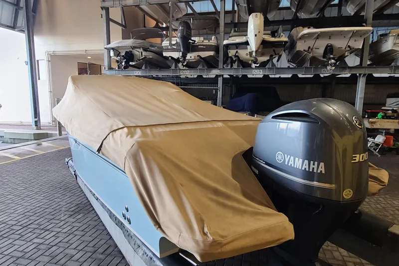 Slide: The Image of 2017 Grady-White Freedom 235 boat with Yamaha 300 engine, covered and stored indoors. - 33
