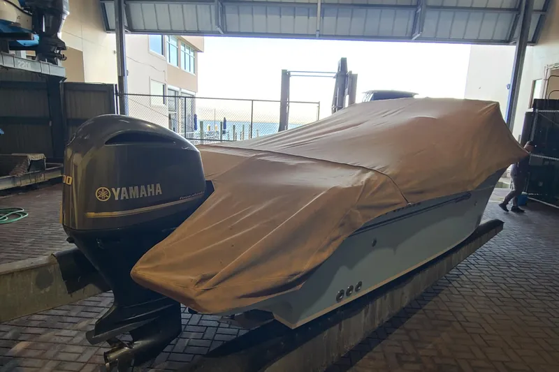 Slide: The Image of Covered 2017 Grady-White Freedom 235 boat with Yamaha outboard in storage facility. - 34