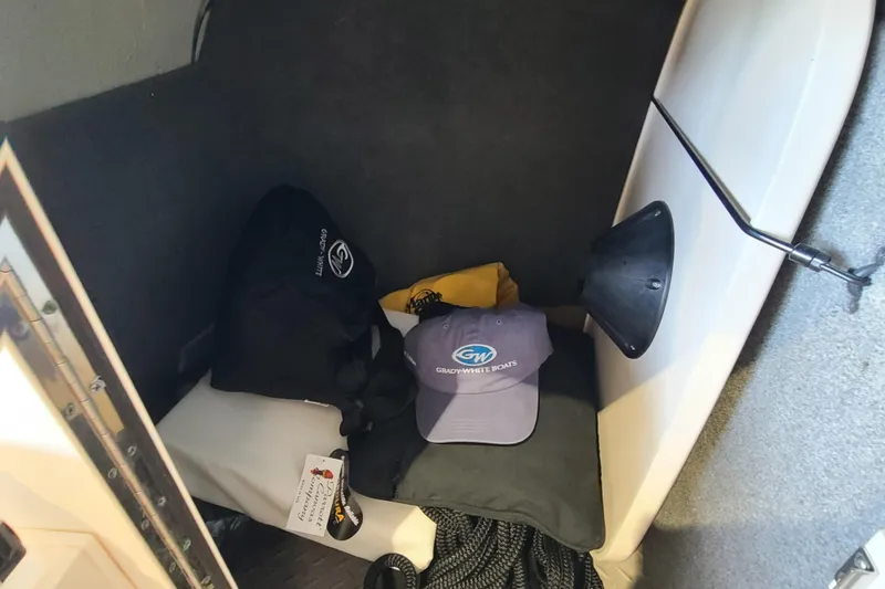 Slide: The Image of Interior of 2017 Grady-White Freedom 235 boat with branded accessories and storage items. - 8