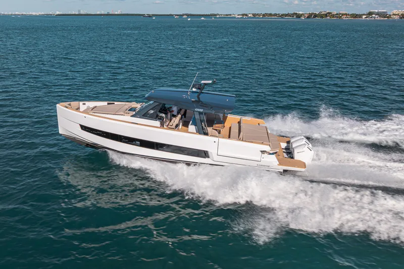 Slide: The Image of 2026 Fjord 490 SPORT yacht cruising on open water, showcasing sleek design and powerful performance. - 1