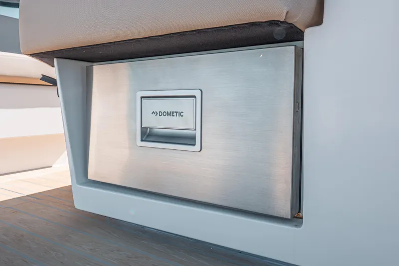 Slide: The Image of Built-in Dometic appliance on 2026 Fjord 490 SPORT boat, featuring sleek design. - 13