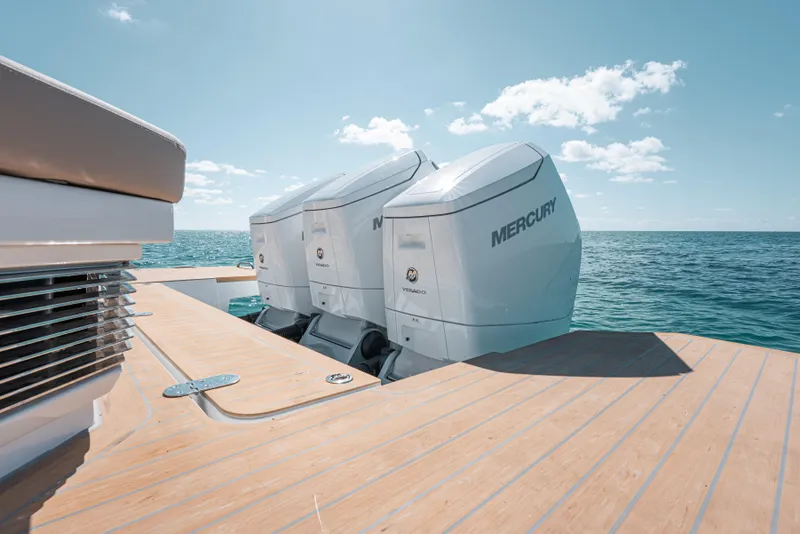 Slide: The Image of Fjord 490 SPORT 2026 boat with Mercury outboard engines on open sea. - 15