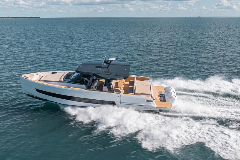 Slide: The Image of 2026 Fjord 490 SPORT cruising on open water, showcasing sleek design and powerful engines. - 2