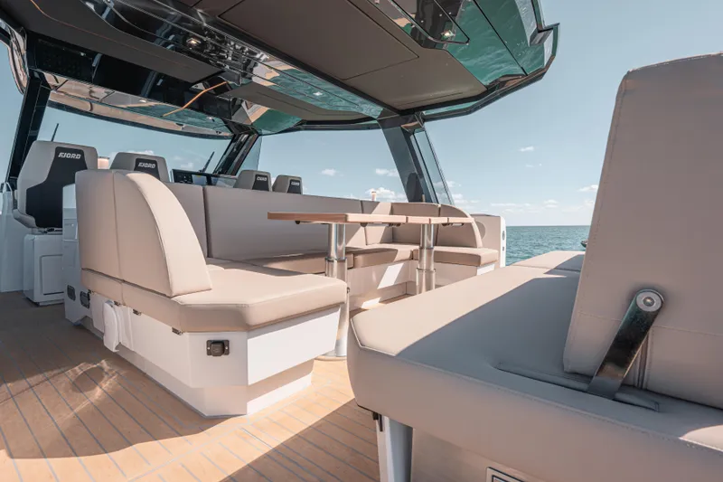 Slide: The Image of Luxurious interior of 2026 Fjord 490 SPORT yacht with modern seating and ocean view. - 23