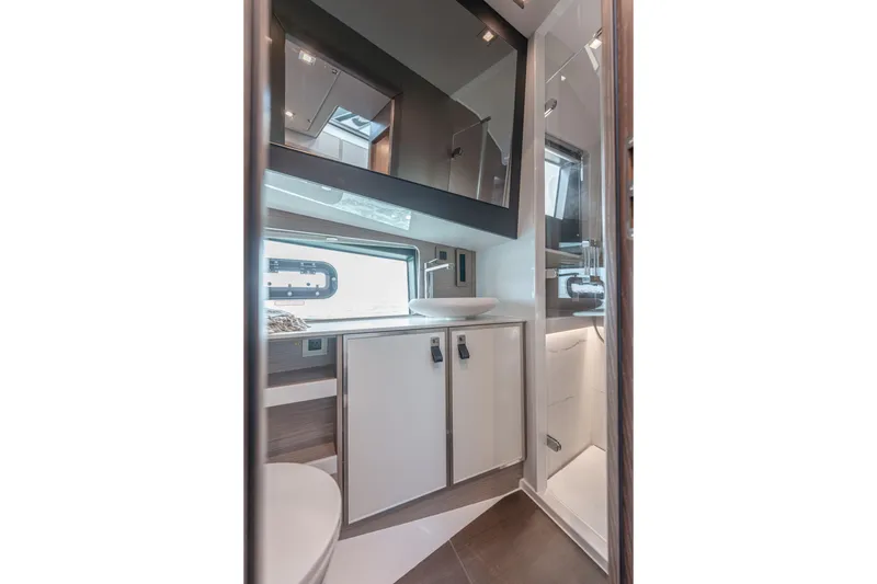 Slide: The Image of Modern bathroom interior of 2026 Fjord 490 SPORT yacht, featuring sleek design and compact functionality. - 26