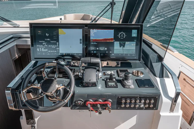 Slide: The Image of Helm of 2026 Fjord 490 SPORT yacht with advanced navigation displays. - 34
