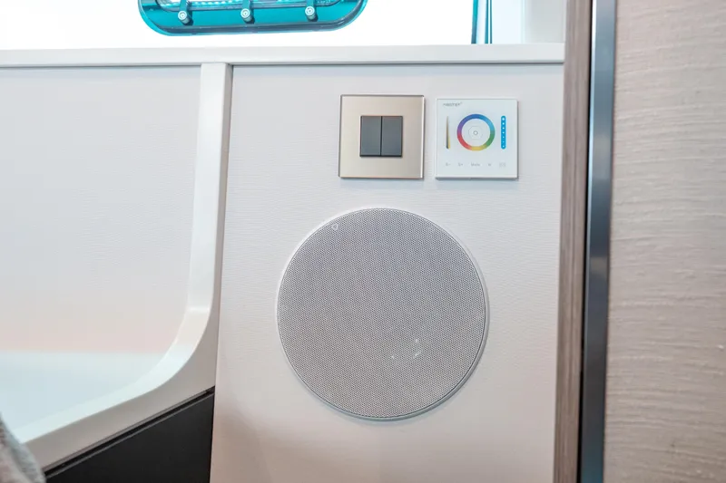 Slide: The Image of Interior of 2026 Fjord 490 SPORT featuring speaker and control panel. - 41