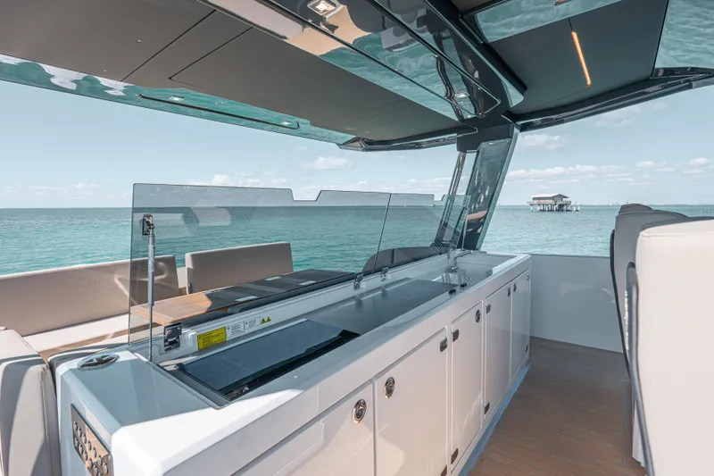 Slide: The Image of 2026 Fjord 490 SPORT yacht interior with sleek design and ocean view. - 43