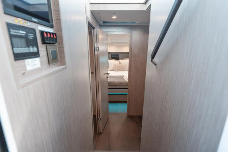 Slide: The Image of Interior view of 2026 Fjord 490 SPORT yacht cabin hallway. - 45