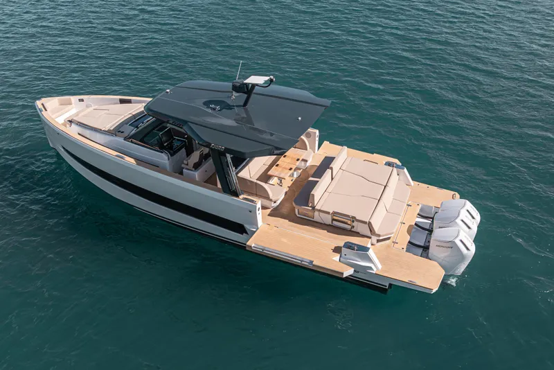 Slide: The Image of 2026 Fjord 490 SPORT luxury boat on open water, featuring sleek design and powerful engines. - 8