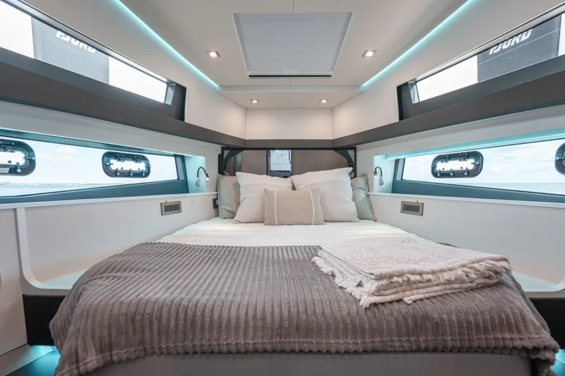 Slide: The Image of Luxurious interior cabin of 2026 Fjord 490 SPORT yacht with cozy bedding. - 21