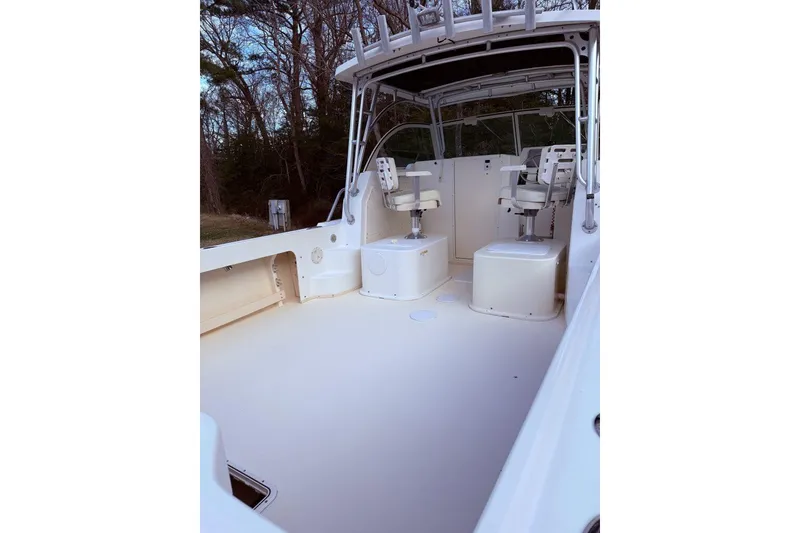 Slide: The Image of 2010 Parker 2510 XL Walkaround boat interior with seating and open deck. - 3