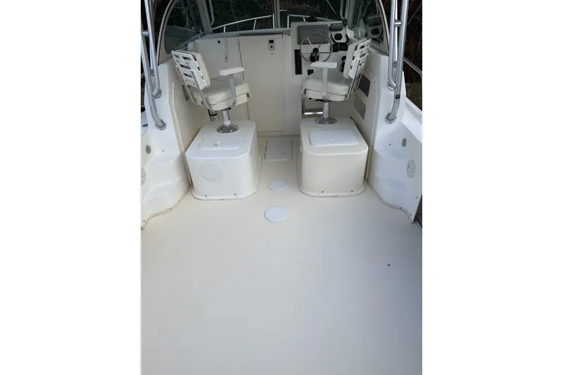 Slide: The Image of 2010 Parker 2510 XL Walkaround boat interior with helm seats and steering wheel. - 4