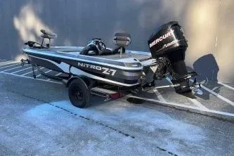 Slide: The Image of 2008 Nitro Z-7 boat with Mercury engine parked on a trailer. - 2