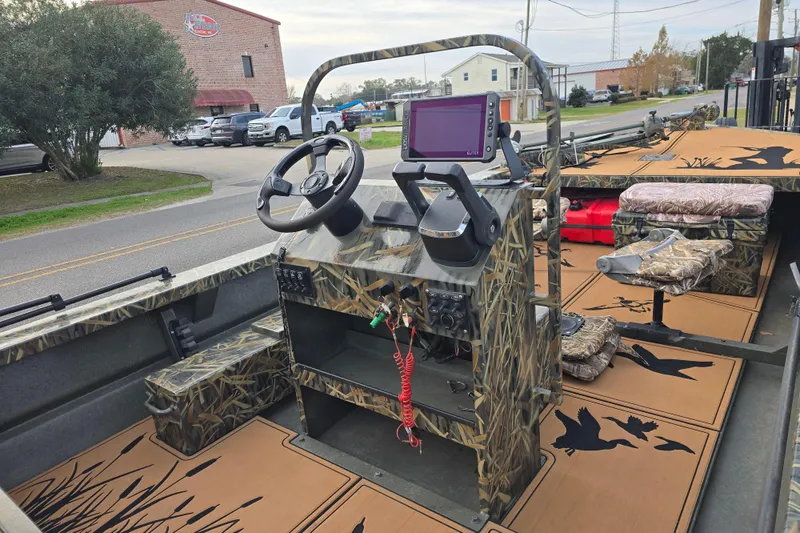 Slide: The Image of 2023 Go-Devil 2072 boat interior with camouflage design and modern navigation equipment. - 17