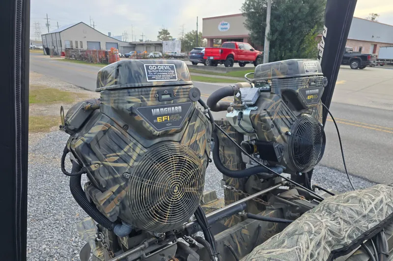 Slide: The Image of Camo-patterned Go-Devil 2072 engines, Vanguard EFI 40, displayed outdoors, 2023 model. - 18