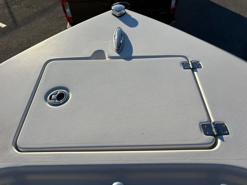Slide: The Image of Cobia 237 Center Console 2022, deck view with storage hatch. - 36