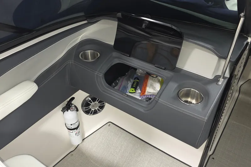 Slide: The Image of 2023 Regal LS4 boat interior with storage, cup holders, and fire extinguisher. - 10