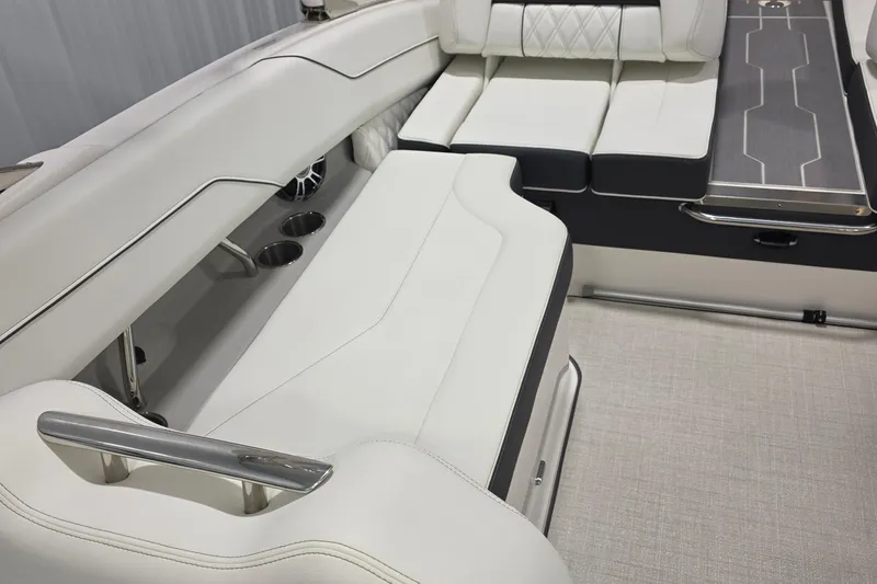 Slide: The Image of 2023 Regal LS4 boat interior with luxurious white seating and stainless steel accents. - 16