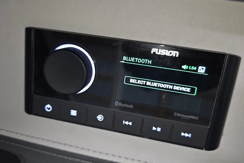 Slide: The Image of 2023 Regal LS4 Fusion Bluetooth audio system with control panel and display. - 17