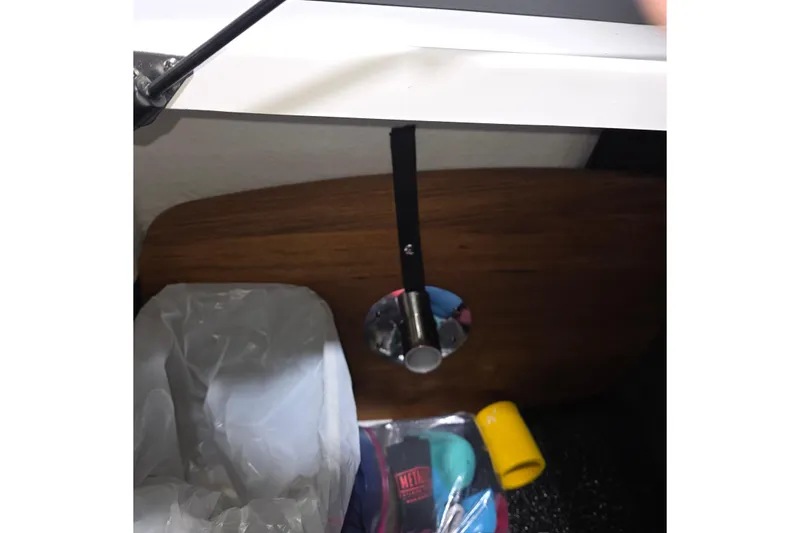 Slide: The Image of 2023 Regal LS4 boat interior with storage compartment and accessories. - 19