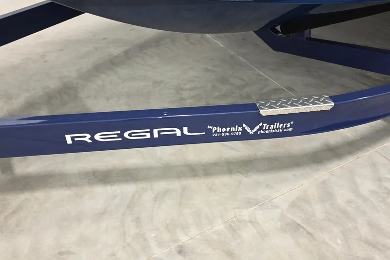 Slide: The Image of 2023 Regal LS4 boat trailer by Phoenix Trailers, blue with logo and contact details. - 23
