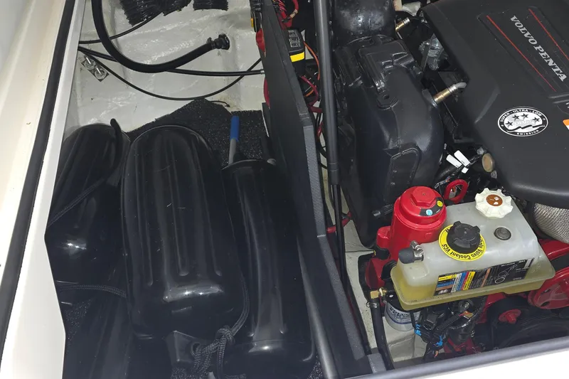 Slide: The Image of 2023 Regal LS4 engine compartment with Volvo Penta engine and black fenders. - 29