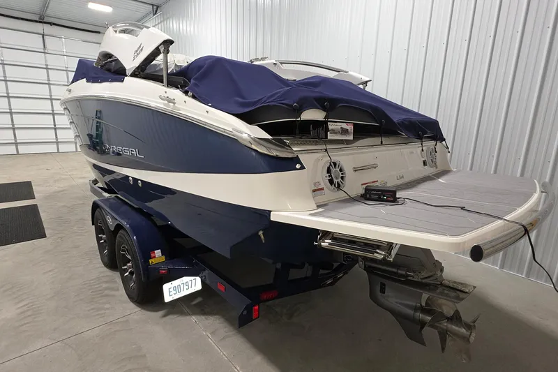 Slide: The Image of 2023 Regal LS4 boat in storage, covered and on a trailer. - 3